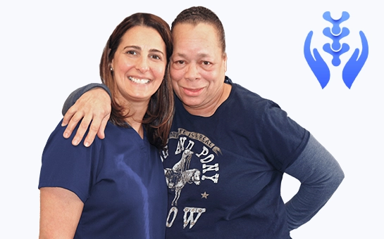Robin L. Steinberg smiling with a patient.